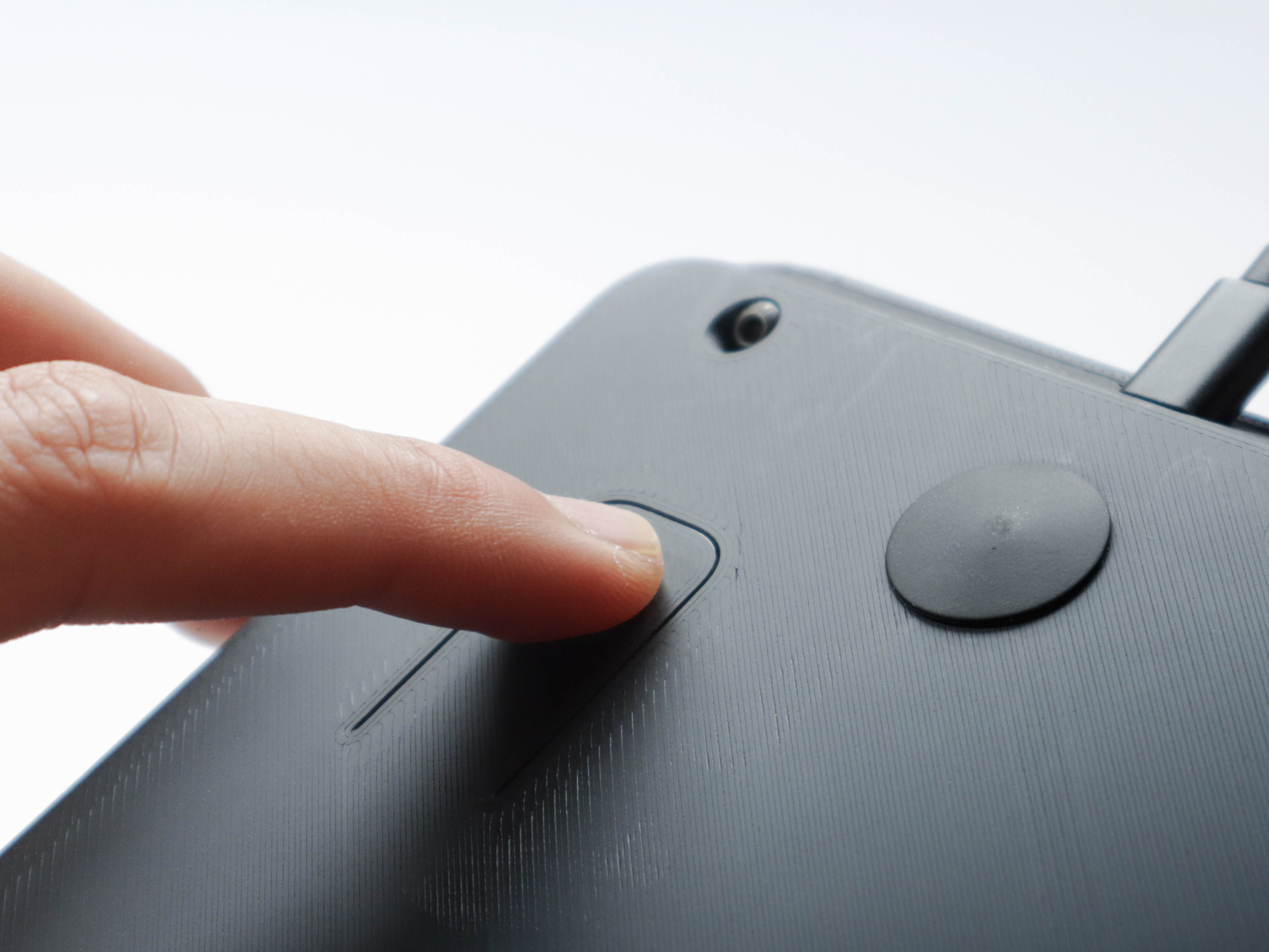 Hidden power button with live hinge