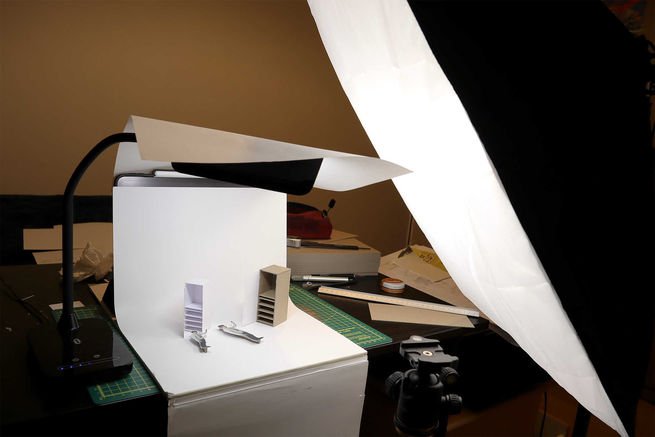 3D printed parts sitting in cardboard box for spray painting