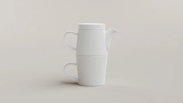 A white teapot and matching mug